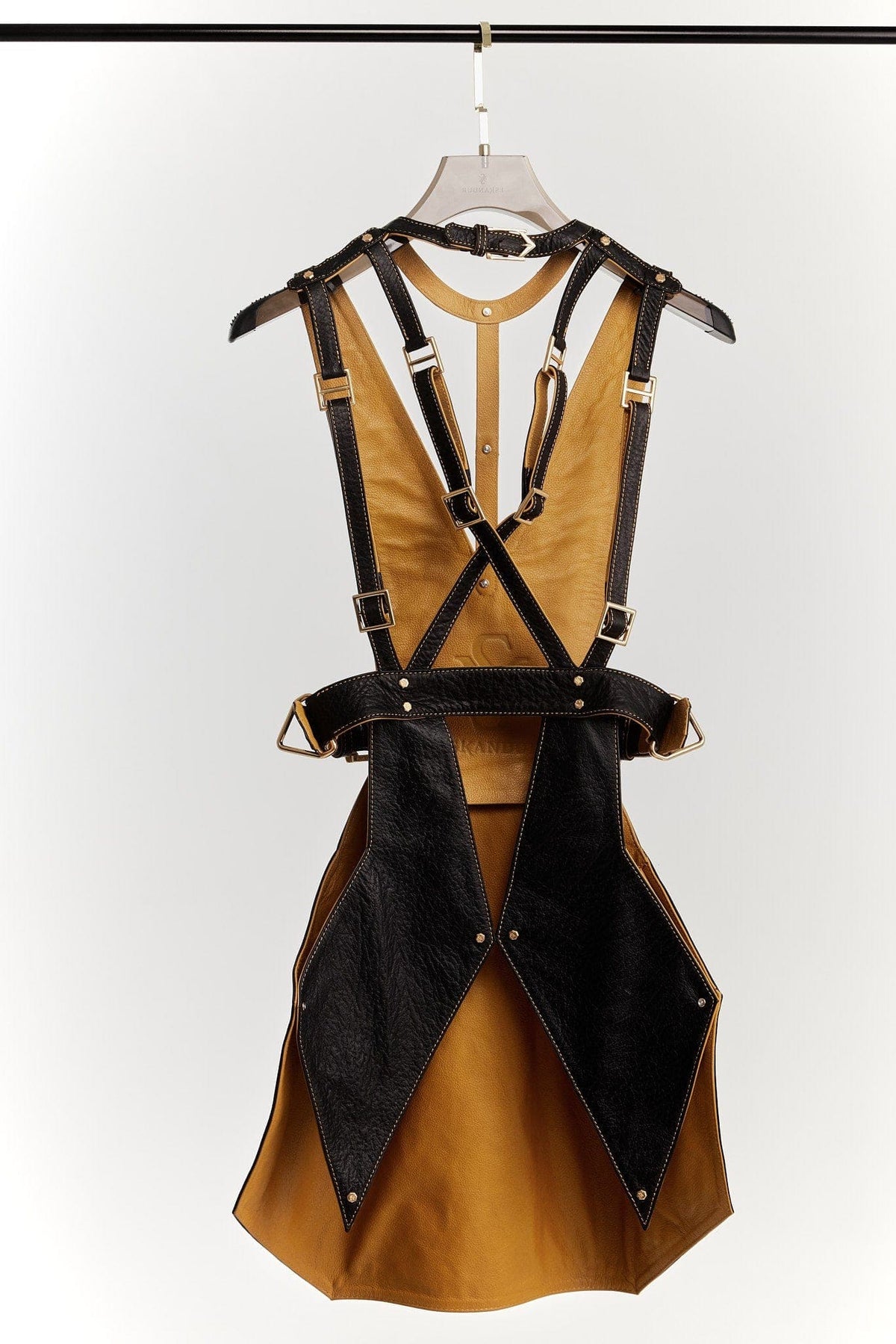 Eskandur women&#39;s black leather luxury premium apron ghost mannequin back view, yellow mustard leather lining hanger